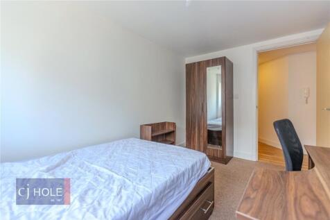 Bright and cozy double bedroom featuring a comf...