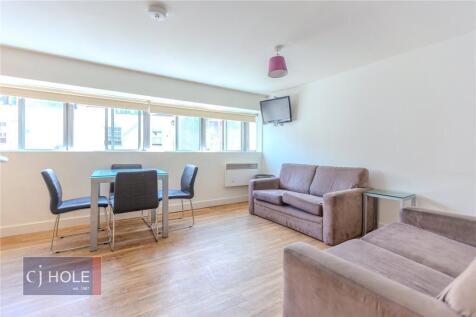 Bright and inviting living room featuring two c...