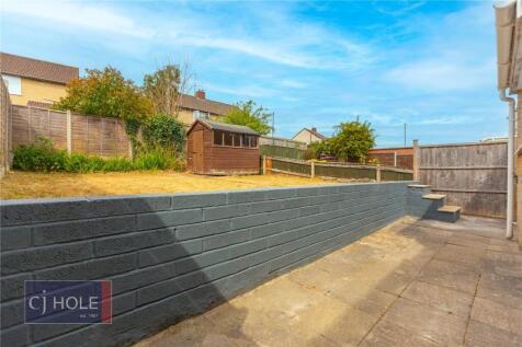 A bright and spacious garden area featuring a p...