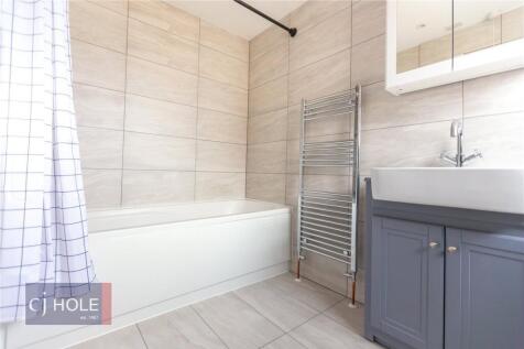 A modern and clean bathroom suite featuring a b...