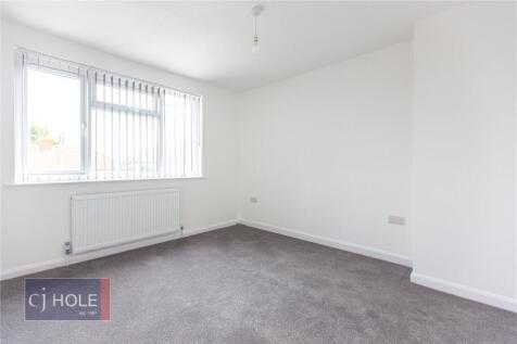 Bright and clean double bedroom featuring a lar...