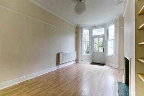 Bright and spacious living room featuring a lar...