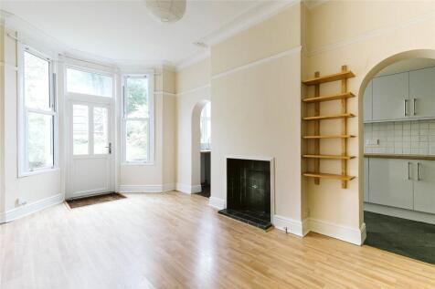 Bright and airy living room with large bay wind...