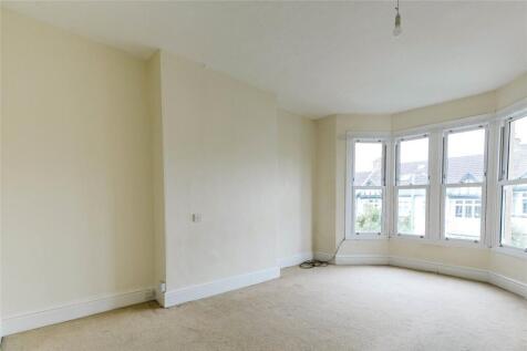 Bright double bedroom featuring a large bay win...