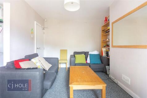A cozy living room featuring comfortable sofas ...