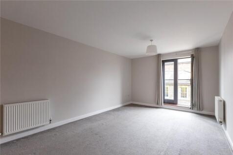 Bright and spacious master bedroom featuring ne...