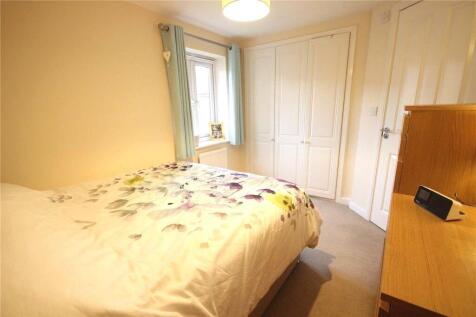 A cozy double bedroom featuring a comfortable d...