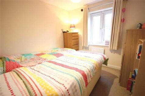 Bright and cozy double bedroom featuring a colo...