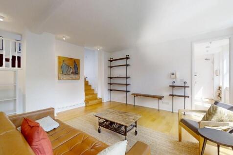 A bright and inviting living room featuring mod...