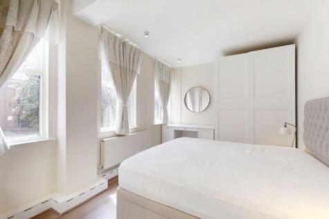 Bright and airy double bedroom featuring a comf...