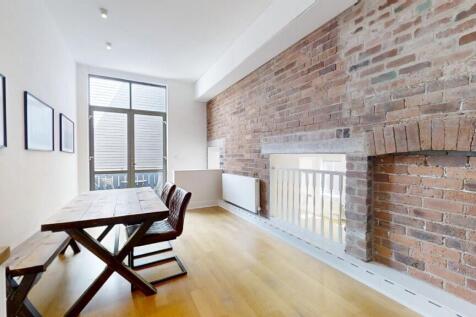 A contemporary living room featuring a stylish ...