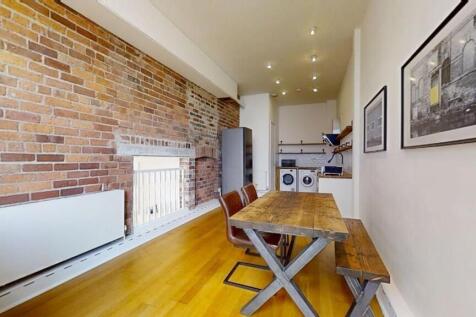 Bright and stylish kitchen featuring a long woo...