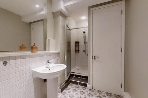 A modern bathroom featuring a clean pedestal si...