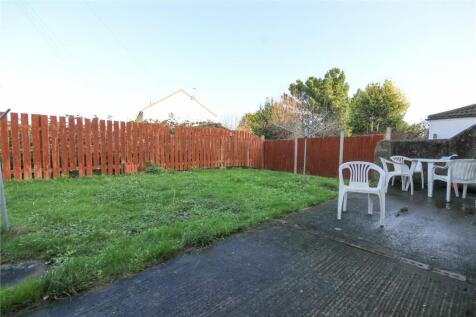 A spacious and well-maintained garden area feat...