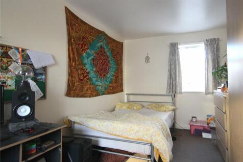 A cozy double bedroom featuring a comfortable d...
