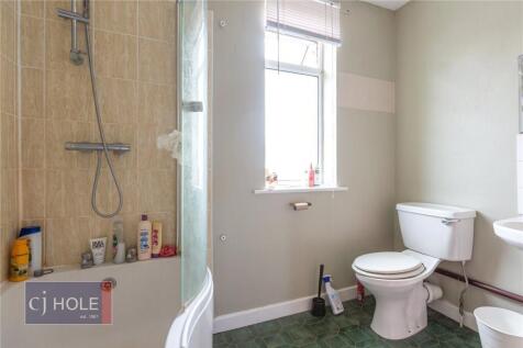 Bright and well-maintained bathroom featuring a...