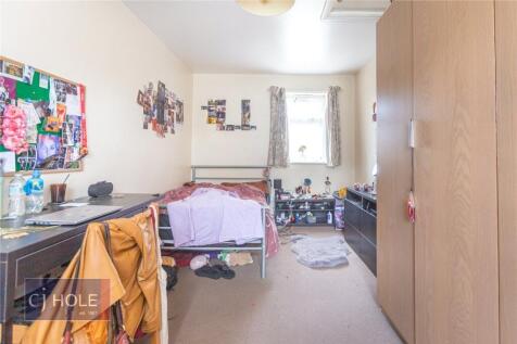 Bright and cozy bedroom with a comfortable sing...