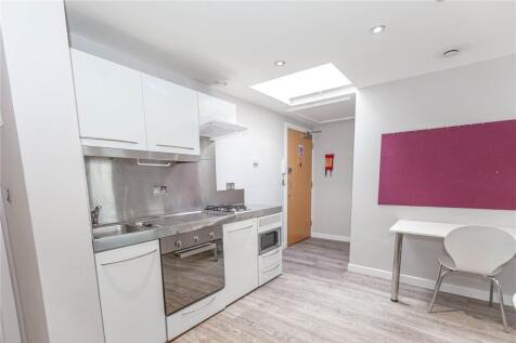 Bright and modern kitchen area featuring sleek ...