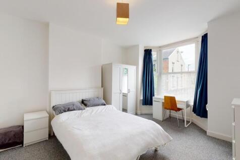 Bright and spacious master bedroom featuring a ...