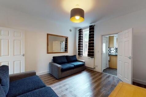 A bright and tidy living room featuring modern ...