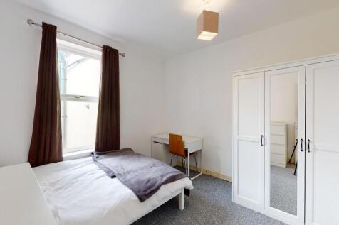 A neat and bright double bedroom featuring a co...