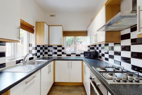 Bright and modern kitchen featuring ample count...