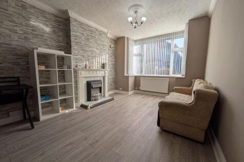 A spacious and inviting modern living room with...