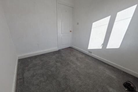 A bright and inviting double bedroom with ample...