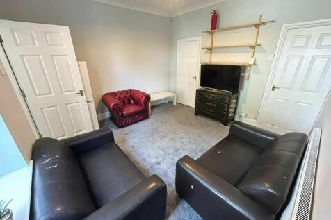Bright and welcoming living room featuring comf...