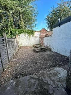 A private outdoor garden space featuring a picn...