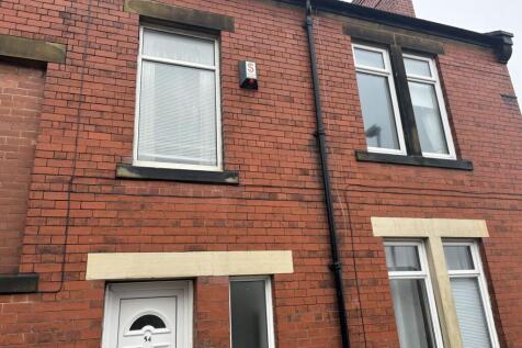 A well-maintained traditional red brick terrace...