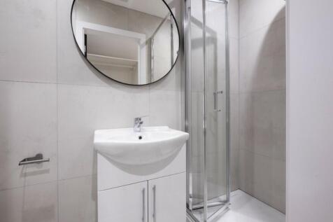 A modern and clean bathroom featuring a sleek s...