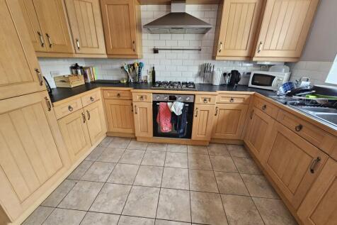 A spacious and well-organized kitchen featuring...
