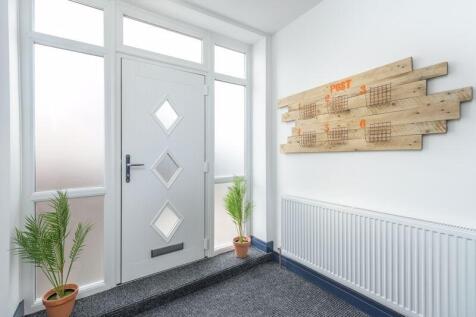 Bright and welcoming hallway featuring a modern...
