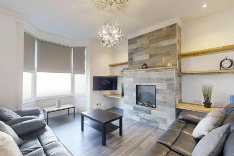 A stylish contemporary living room featuring co...
