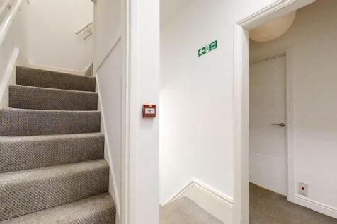 A clean and well-maintained staircase area with...