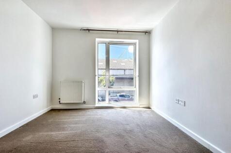 Bright and airy double bedroom featuring a larg...