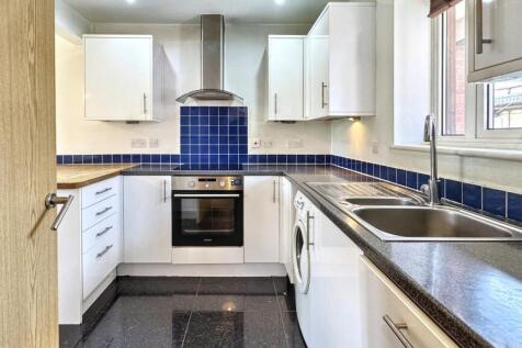 Modern kitchen featuring a sleek electric hob a...