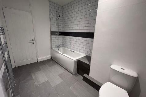 A modern and well-maintained bathroom featuring...