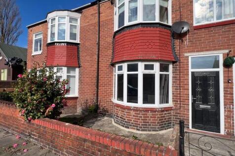 A charming front view of a traditional terraced...