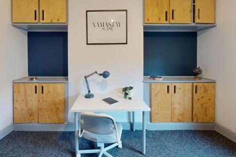 A neat and well-organized communal workspace fe...