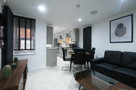 This contemporary living room features elegant ...