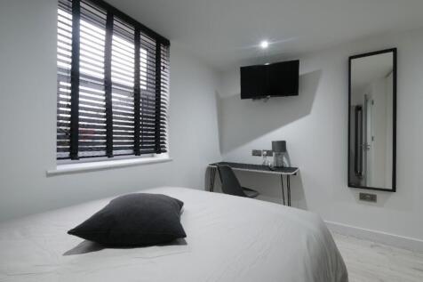 This inviting double bedroom offers a comfortab...
