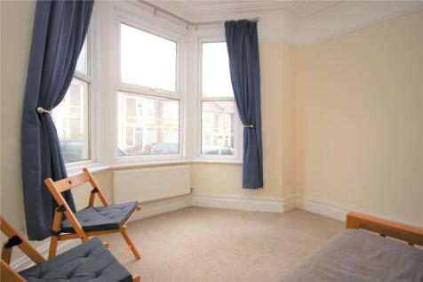 Bright double bedroom featuring a spacious bay ...