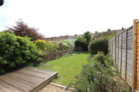 A well-maintained private garden featuring a wo...