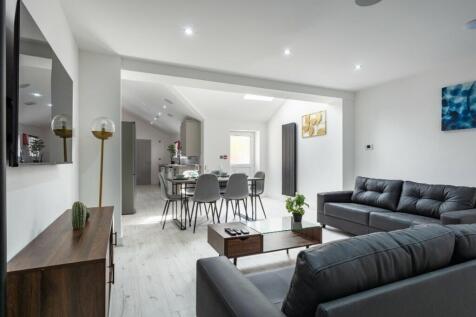 This stylish living room features ample space f...