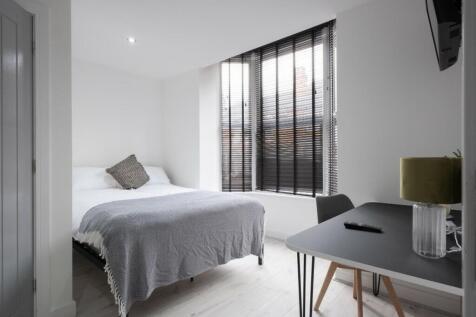 A beautifully designed double bedroom featuring...