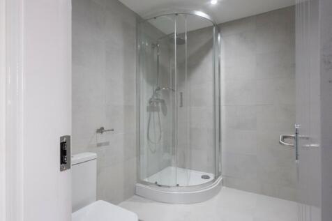 A modern bathroom featuring a sleek design with...