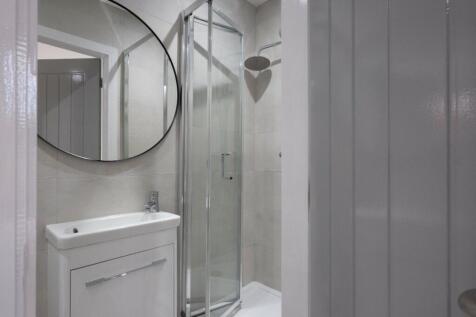 Modern and stylish bathroom featuring a sleek s...