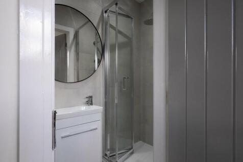 Modern bathroom featuring a sleek design with a...